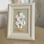 Keraminis angelas rėmelyje