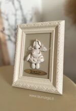 Keraminis angelas rėmelyje