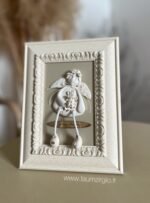 Keraminis angelas rėmelyje