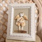 Keraminis angelas rėmelyje „Angelas sargas”